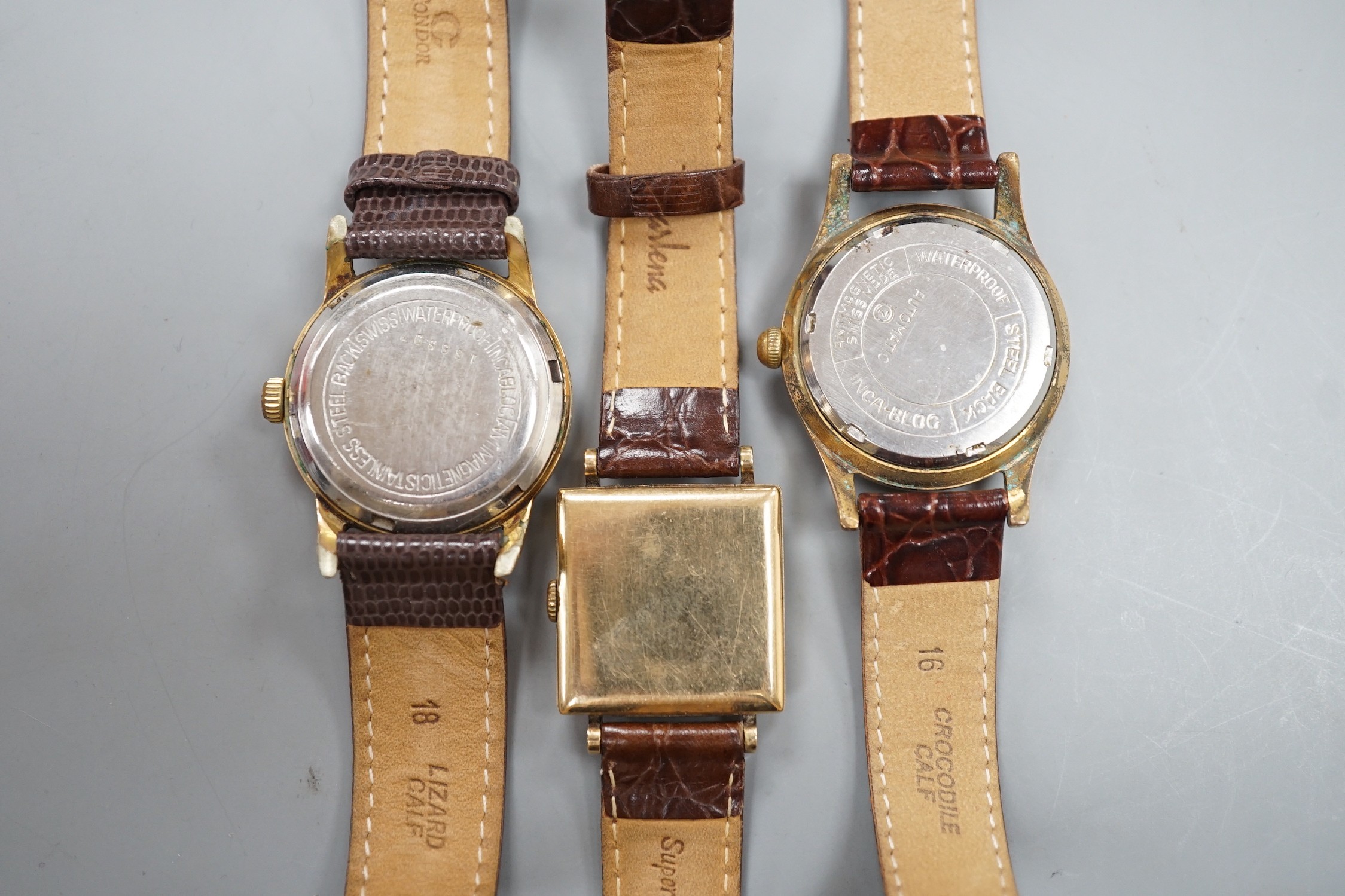 A gentleman's 1940's 9ct gold Marvin square dial manual wind wrist watch, on a later leather strap, together with two other gentleman's steel and gold plated wrist watches, Cornavin and Curtiss automatic.